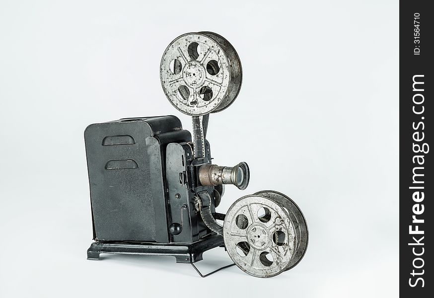 A retro cine camera on a plain grey background. A retro cine camera on a plain grey background