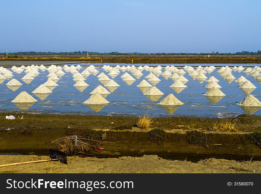 Pile of salt in the salt pan at rural area of Thailand. Pile of salt in the salt pan at rural area of Thailand.