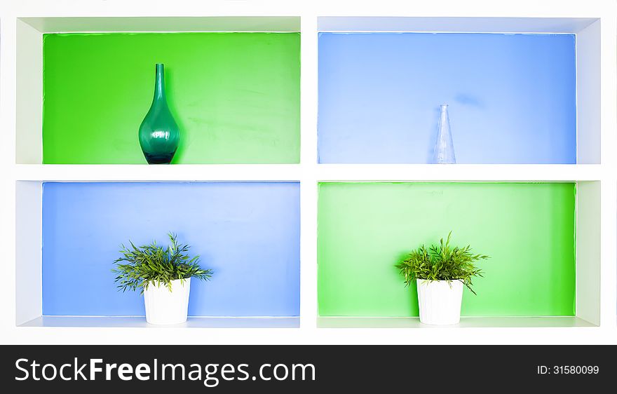 Beautiful colorful shelves with vase.