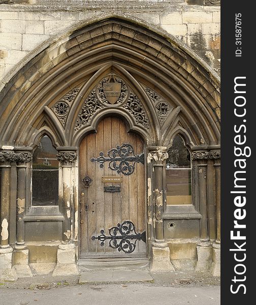 Image of church door taken of the church house entrance, gloucerster chathedral, england