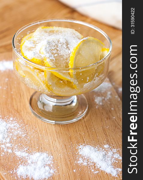 Lemon dessert in a bowl with sugar and powdered sugar