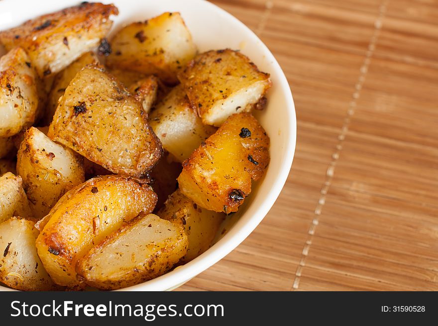Baked potatoes in a rural, in a bowl on a napkin. close-up