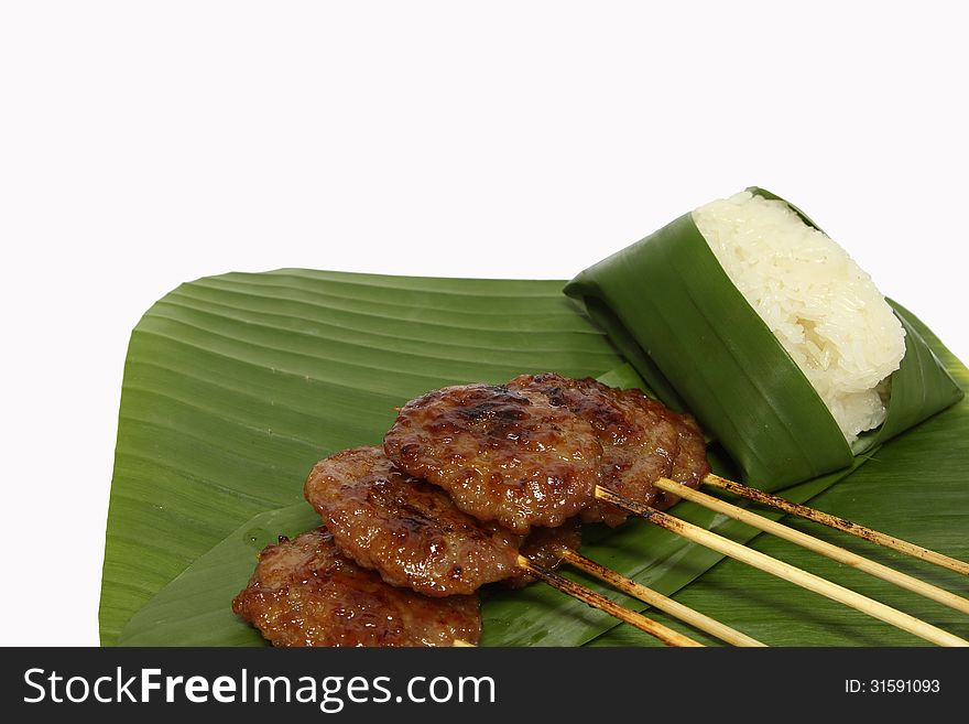 Grilled pork with sticky rice on white background