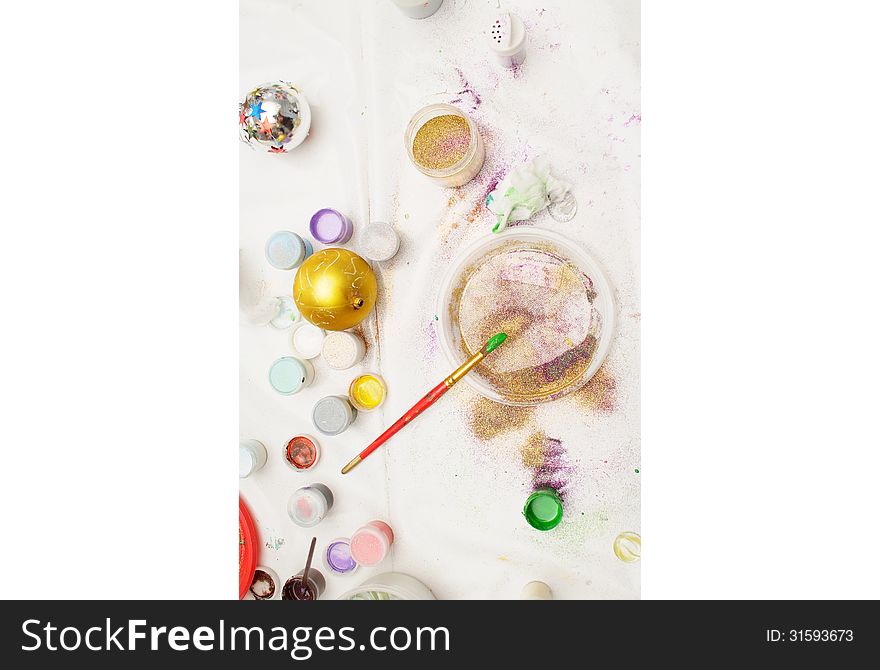 Top view of working place for funny creations (hobby). Some instruments and materials on a white table