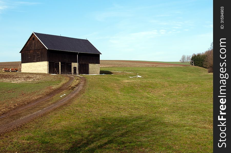 Old barn on green meadow