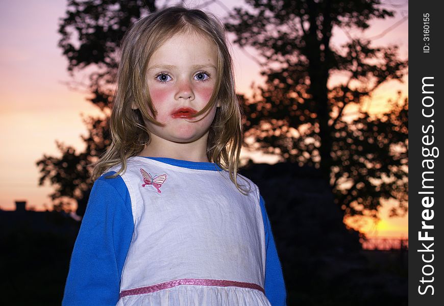 Little girl with smear out lipstick. Little girl with smear out lipstick