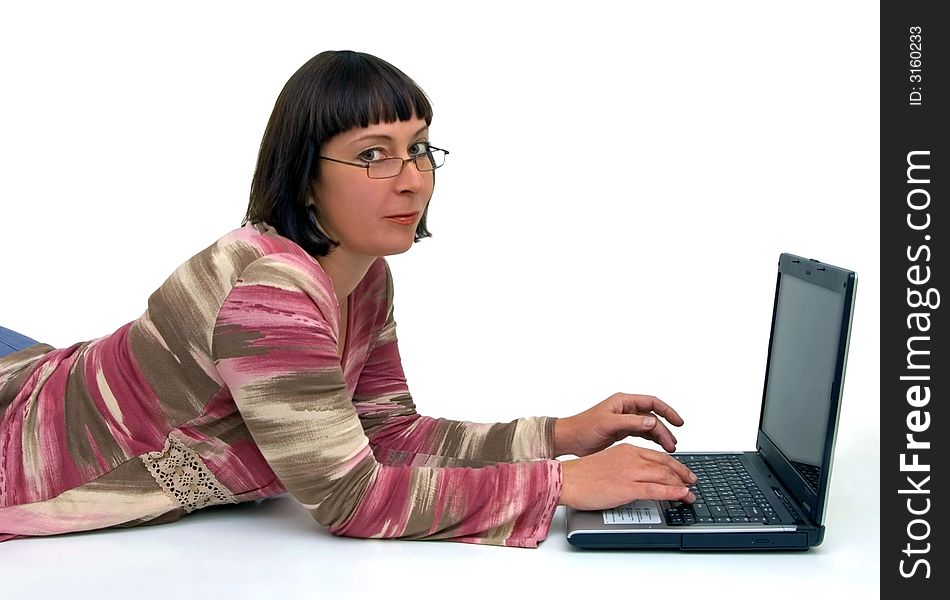Woman works at computer in relaxed situation. Woman works at computer in relaxed situation