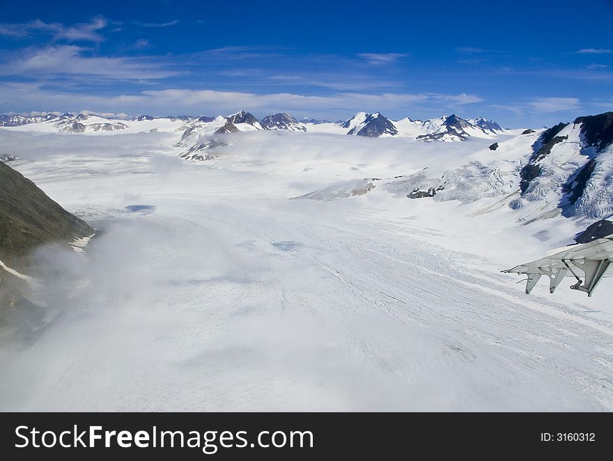 Mountain peaks above the snow and clouds near Skagway Alaska. Mountain peaks above the snow and clouds near Skagway Alaska