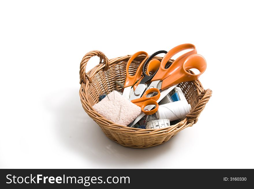 Basket with scissors, pins and threads