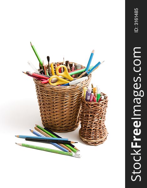 Basket with pensils on white background. Basket with pensils on white background