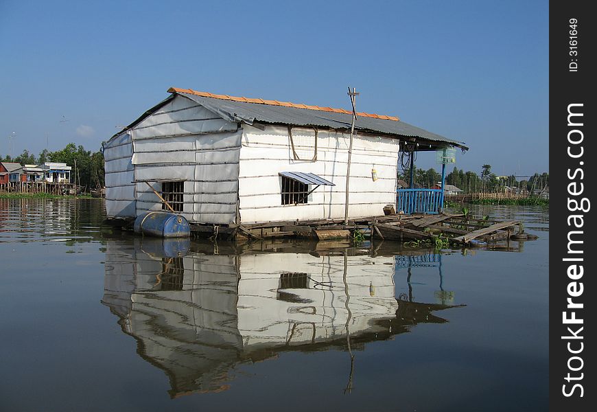 Floating Fish Farm and house on the Mekong River, Vietnam