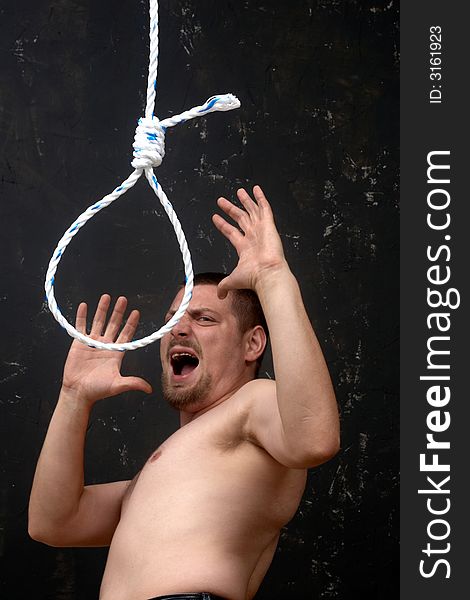A man shouting to a rope noose. A man shouting to a rope noose