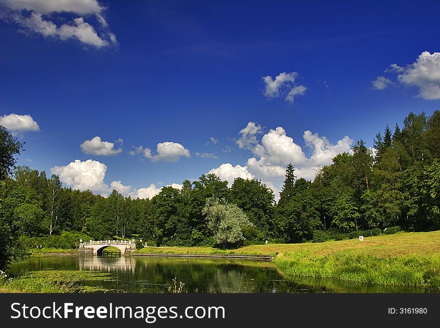 Landscape with blue sky, clouds, forest and lake. Landscape with blue sky, clouds, forest and lake