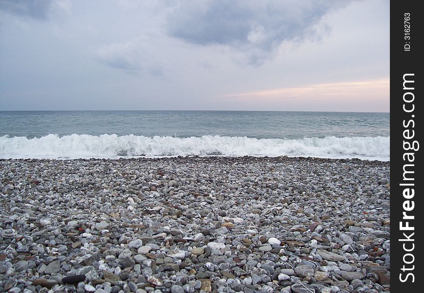 Sea seen from a stone beach. Sea seen from a stone beach