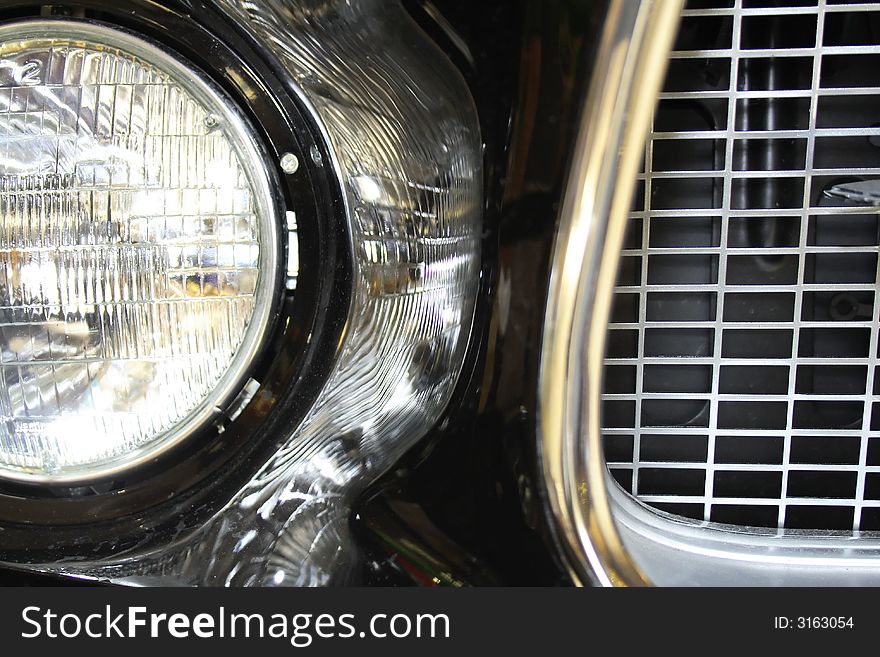 Old black mustang car detail photo.