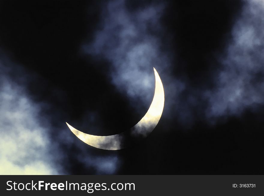 Solar eclipse on a background of clouds. Solar eclipse on a background of clouds