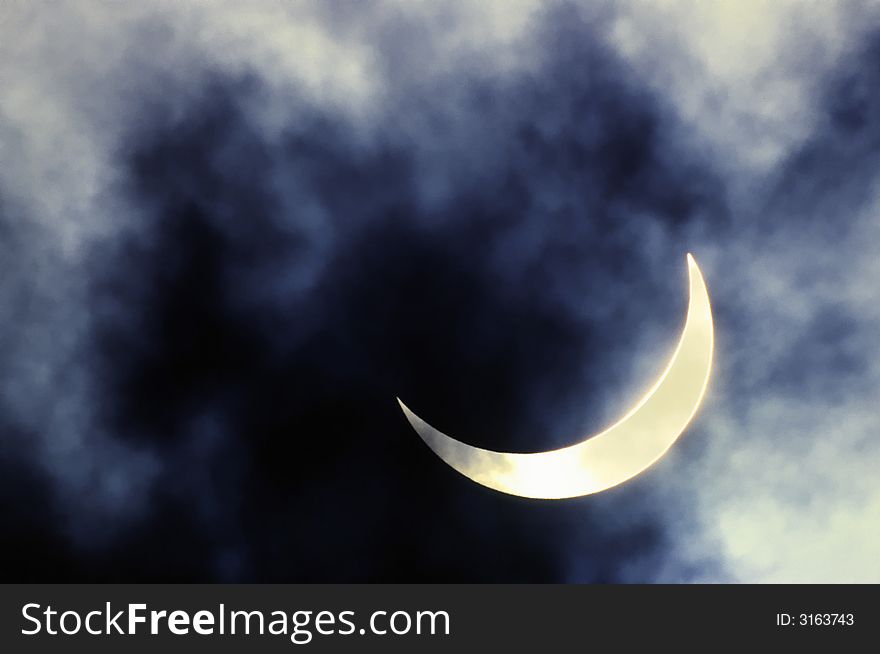 Solar eclipse on a background of clouds. Solar eclipse on a background of clouds