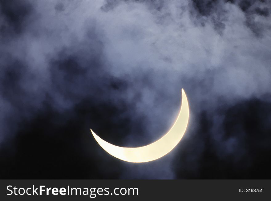 Solar eclipse on a background of clouds. Solar eclipse on a background of clouds