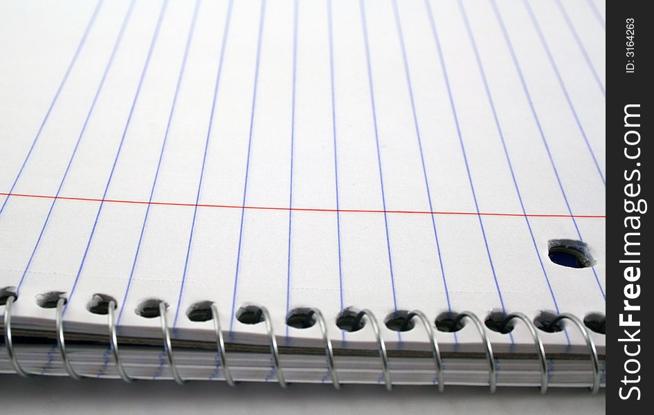 View of a notebook and its spiral binder.