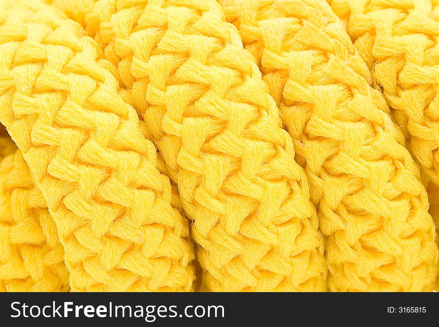 Coils of a yellow cord close up. Coils of a yellow cord close up