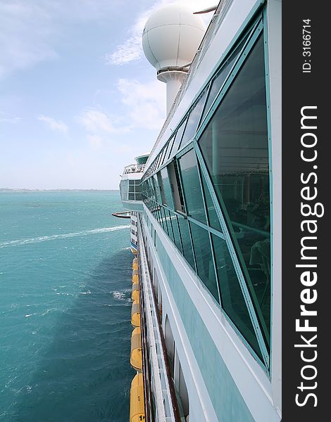 View down the side of a moving cruise ship. View down the side of a moving cruise ship