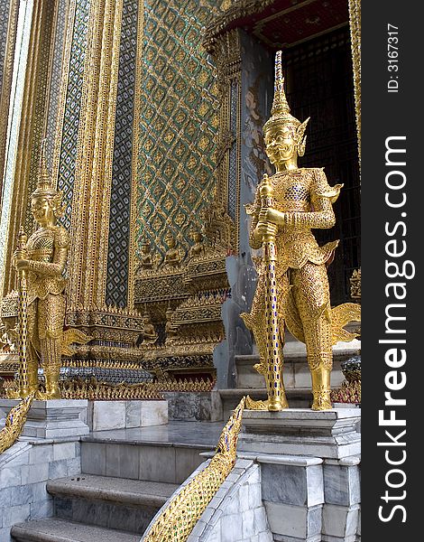 Two Gold statues in thailand palace