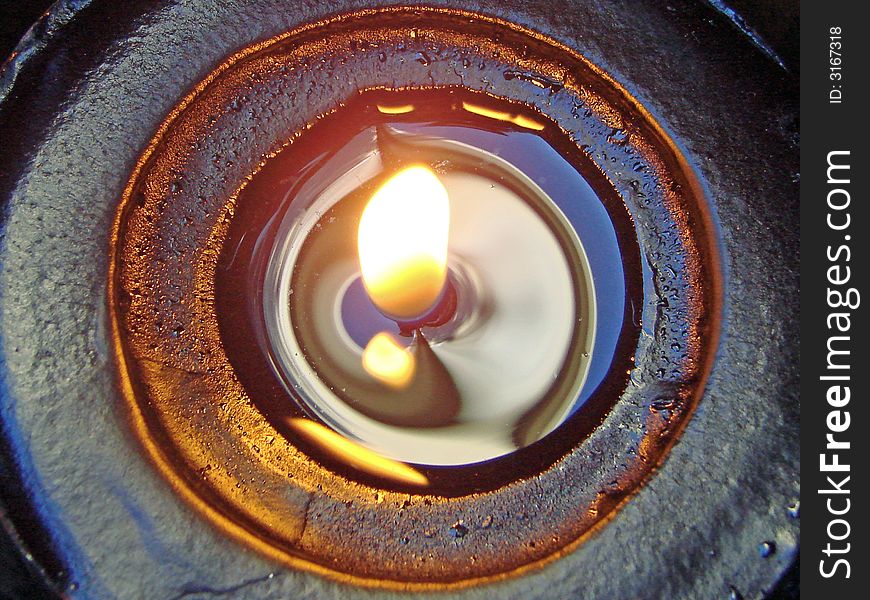 A close-up of a lit candle. A close-up of a lit candle