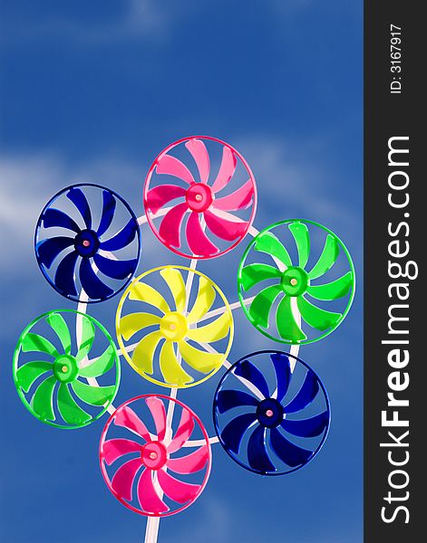 Spinner toy on the blue skies background