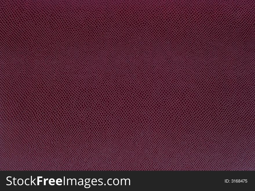 Fragment of brown leather detailed background. Fragment of brown leather detailed background