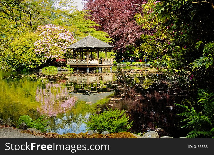 Wooden pavilion on the pond in japanese garden. Wooden pavilion on the pond in japanese garden