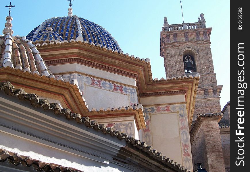 A church dome with bell tower showing off the elaborate architecture. A church dome with bell tower showing off the elaborate architecture.
