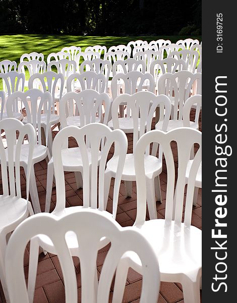 White aisle chairs at a wedding. White aisle chairs at a wedding