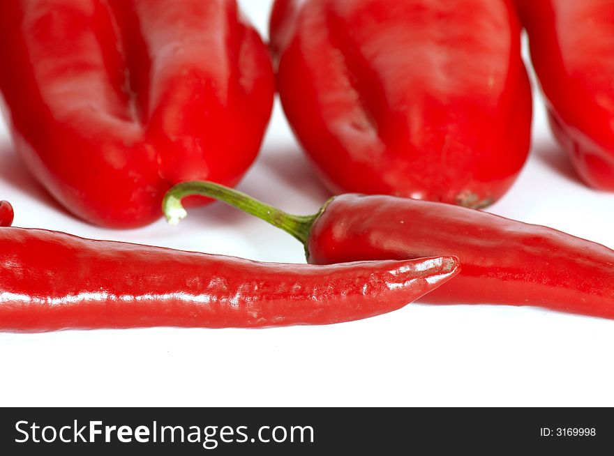 An image of various red hot peppers