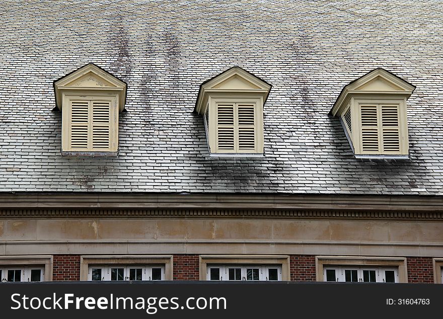 Three Shuttered Windows On Roof