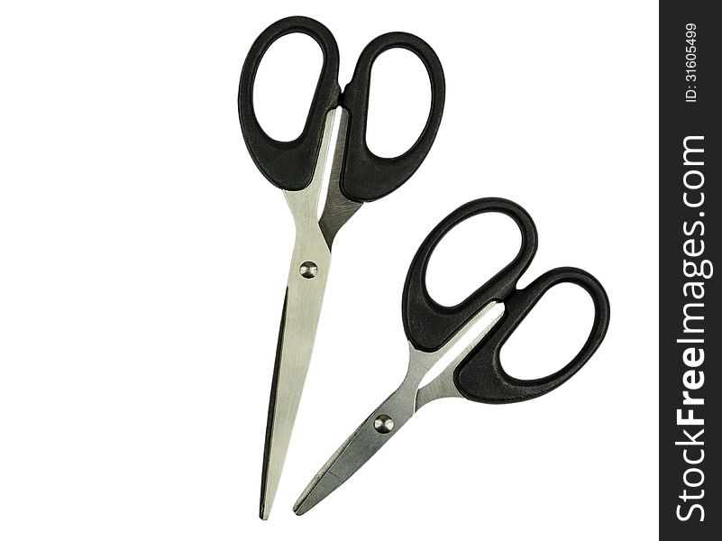 Two black scissors isolated on white