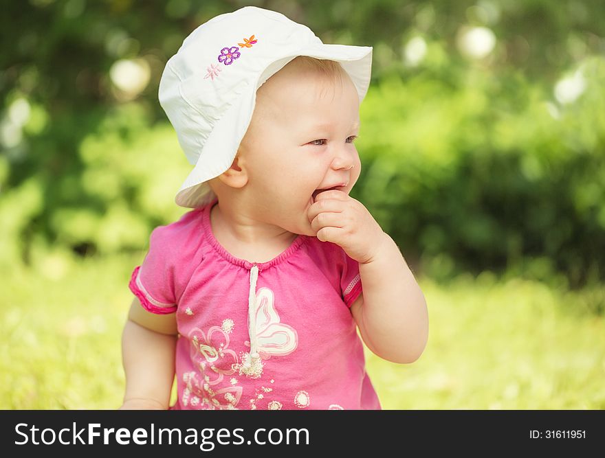 Portrait of cute little baby girl smiling in the garden. Portrait of cute little baby girl smiling in the garden