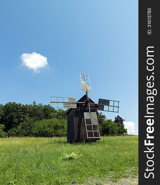 Old wooden windmill near the village in Folk Arts museum Pirogovo, Kiev, Ukraine