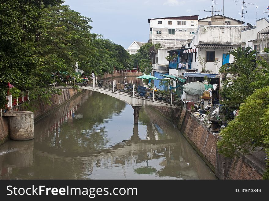 Small bridge over a canal in Bangkok, Thailand