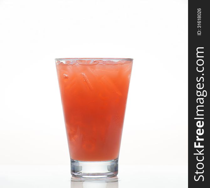 Fresh carrot vegetable drink in glass on white background