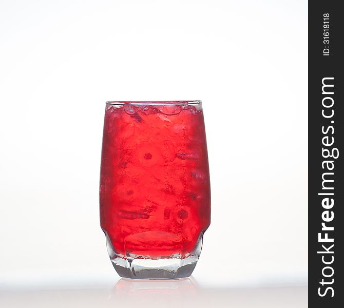 Red fruit flavour soft drinks with soda water on white background