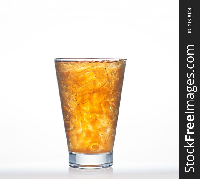 Lemon tea Thai drinks style with ice in glass on white background. Lemon tea Thai drinks style with ice in glass on white background