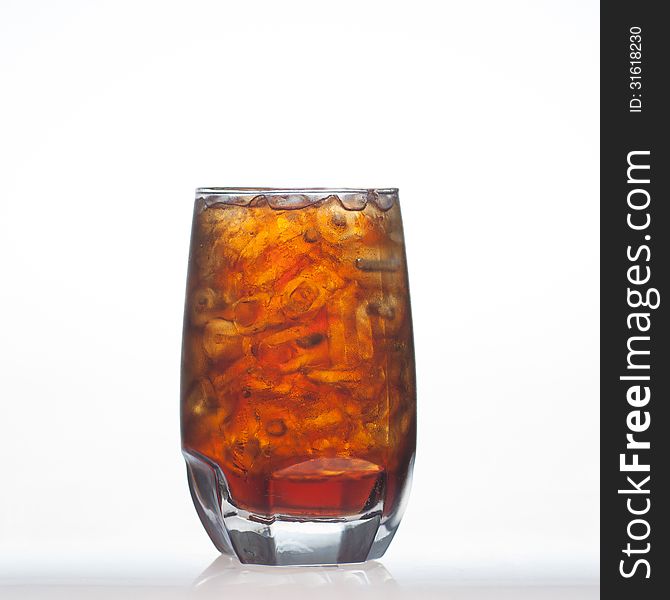 Root beer flavour aerated drinks whit water soda and ice in glass on white background. Root beer flavour aerated drinks whit water soda and ice in glass on white background