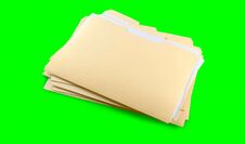 Stack Of Yellow Folders With Blank Labels On A Green Background. Chroma Key. Royalty Free Stock Photo