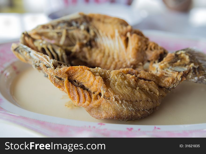 Fried snapper with fishsauce on the plate