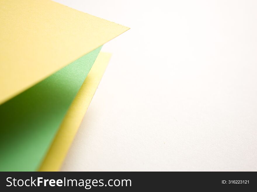 Green, yellow and white 3d geometric background, copy space, close up