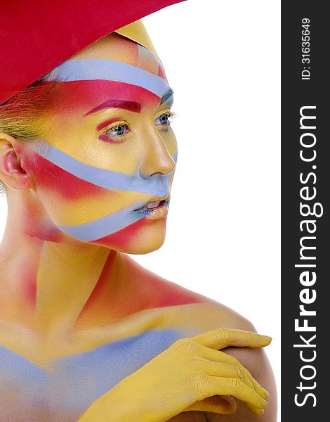 Woman with creative geometry make up, tree color red, yellow, blue close up