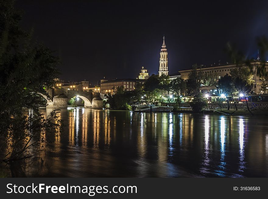 Night view of the Mudejar Cathedral, Stone Bridge and the river at Saragossa, Spain. Night view of the Mudejar Cathedral, Stone Bridge and the river at Saragossa, Spain