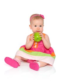 Happy Little Baby Girl In Bright Multicolored Festive Dress With Royalty Free Stock Image