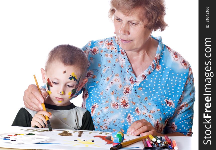 Grandmother teaches his grandson drawing isolated. Grandmother teaches his grandson drawing isolated