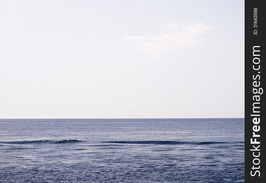 The calm Aegean sea with the sun reflecting in the water. The calm Aegean sea with the sun reflecting in the water